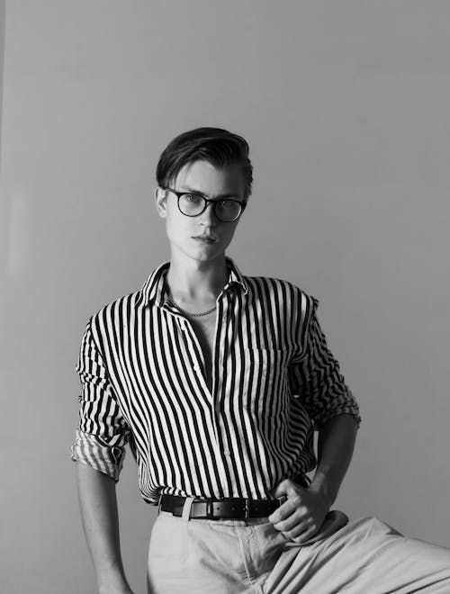 Black and White Studio Shoot of a Young Man Wearing Striped Shirt