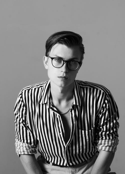 Black and White Studio Shoot of a Young Man Wearing Striped Shirt