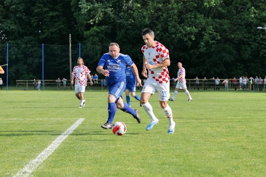 Players in action during a soccer match in Garešnica, showcasing teamwork and competition.