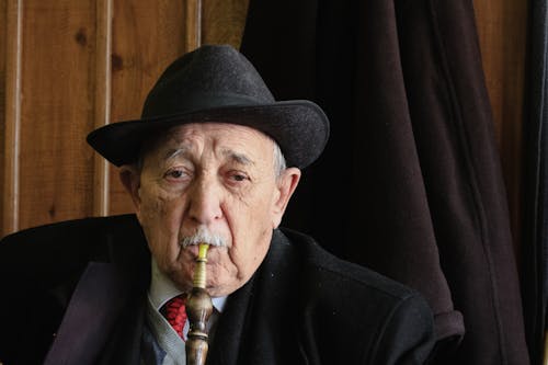Eldery Man Smoking Shisha 