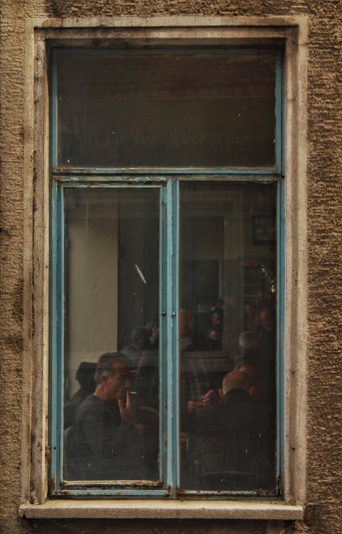 Restaurant Window with People Inside 