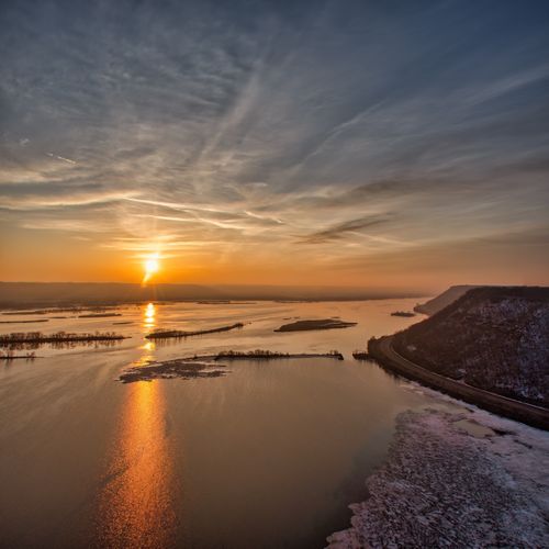 Free A breathtaking winter sunset over the Mississippi River at Minneiska, Minnesota. Stock Photo