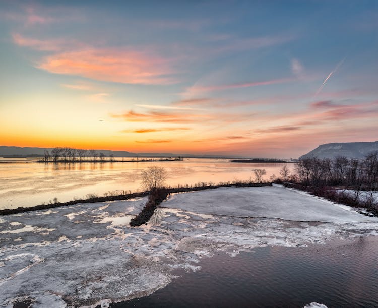 Frozen Lake In A Sunset