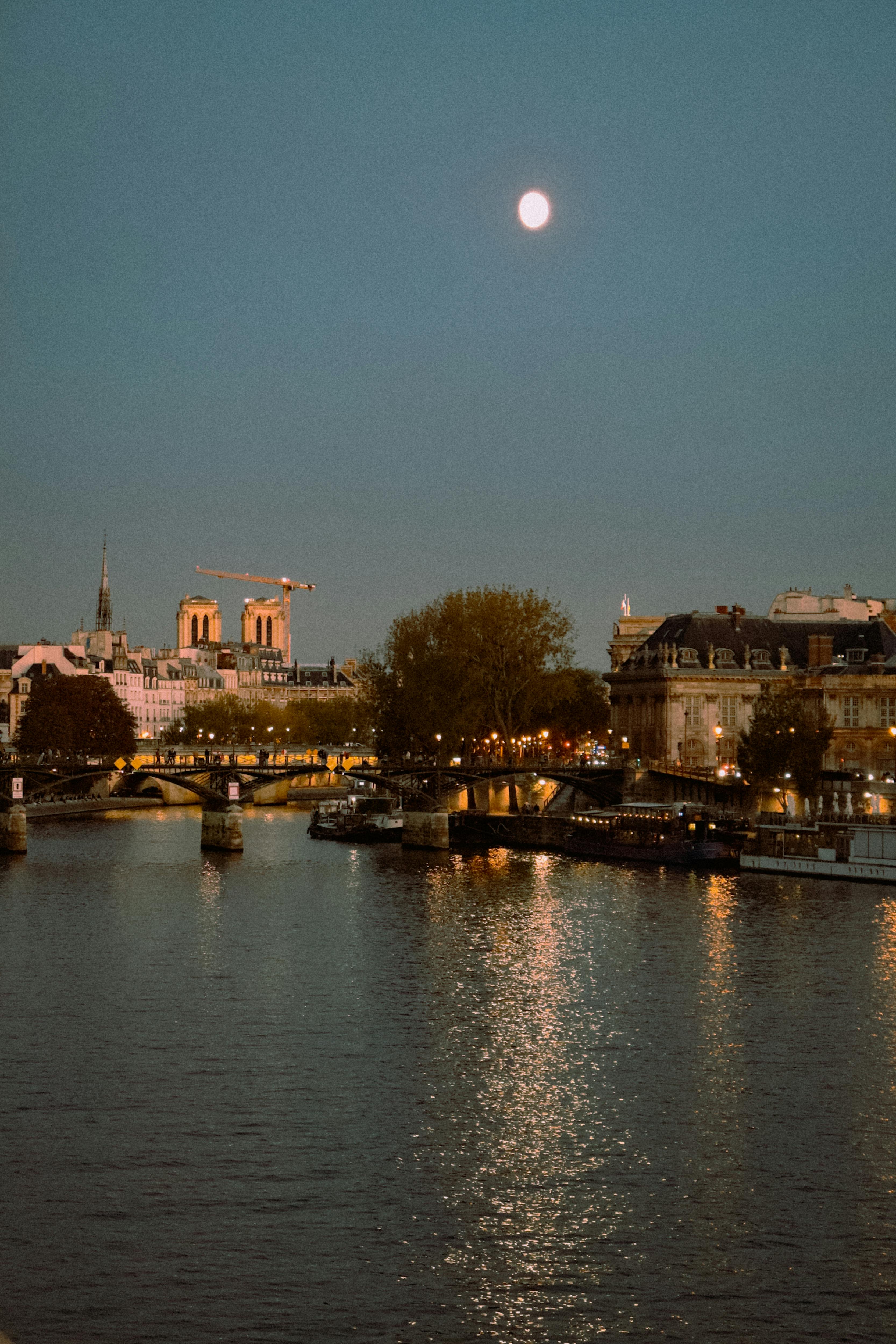 The Moon Rises Over The Seine River In Paris · Free Stock Photo