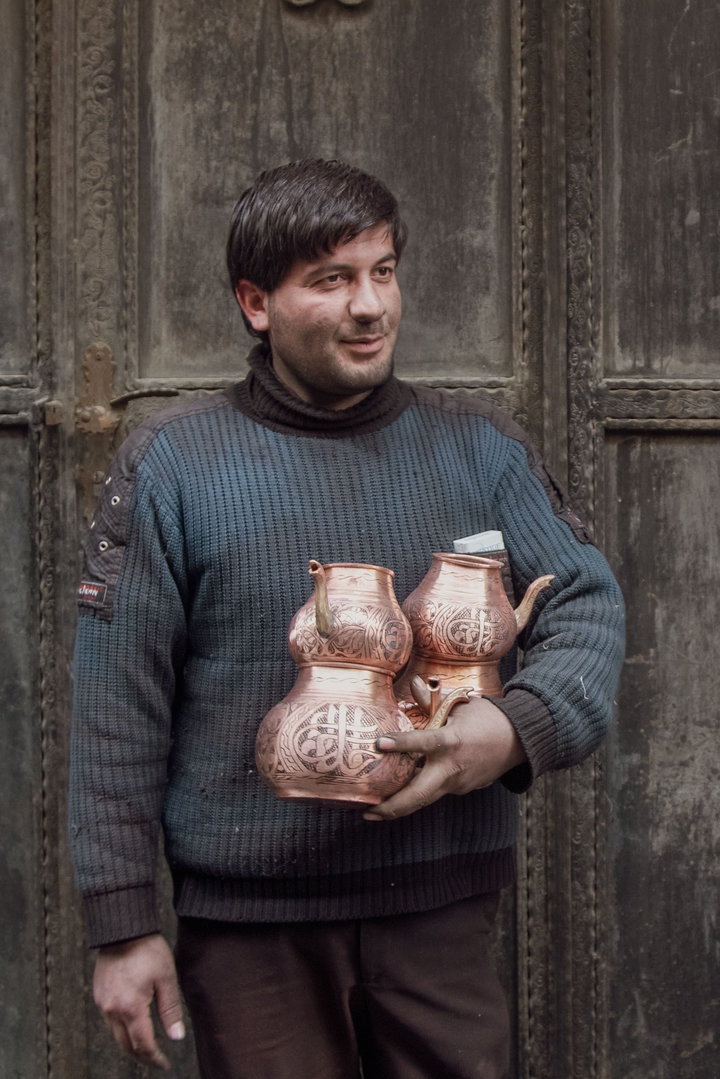 Man Holding Ornate Traditional Tea Pot · Free Stock Photo