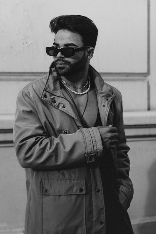 Black and White Picture of a Fashionable Man Wearing a Jacket and Sunglasses