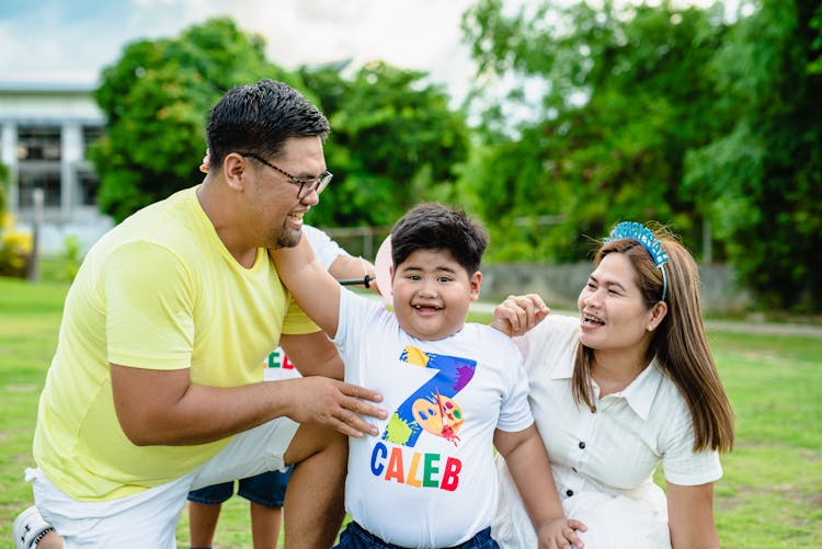 Happy Family In Park