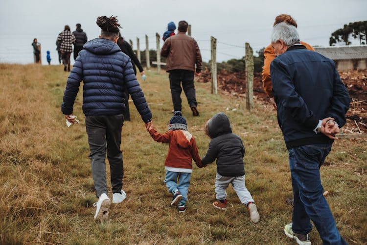 Father With Sons Holding Hands