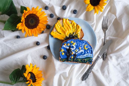 Colorful artistic toasts inspired by Van Gogh, accented with sunflowers and blueberries.