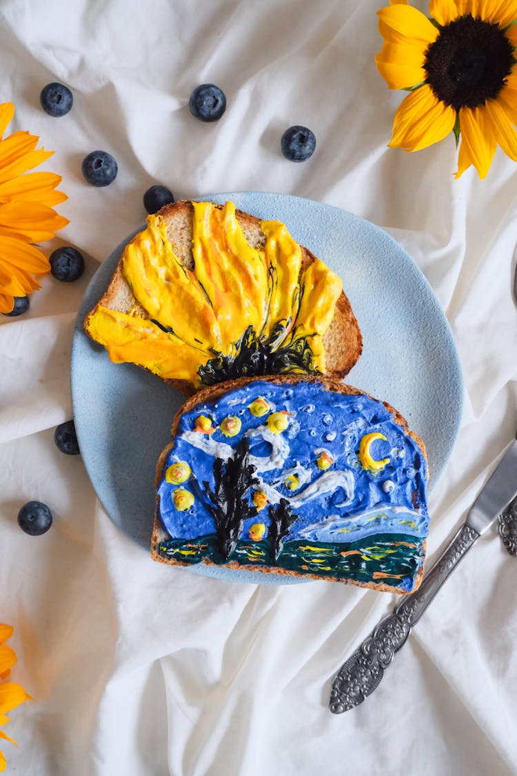 Bread With Frosting Illustrating The Starry Night And Sunflowers Paintings By Van Gogh