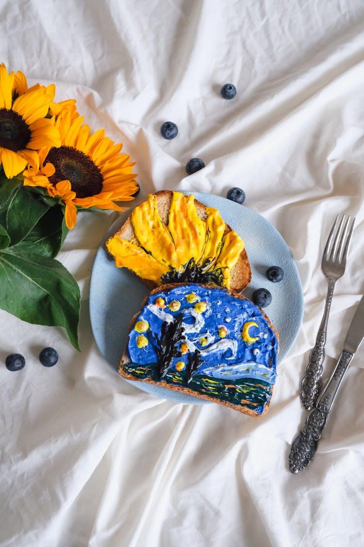 Bread With Frosting Illustrating The Starry Night And Sunflowers Paintings By Van Gogh