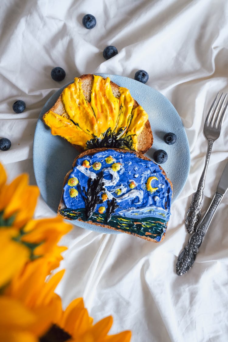 Bread With Frosting Illustrating The Starry Night And Sunflowers Paintings By Van Gogh