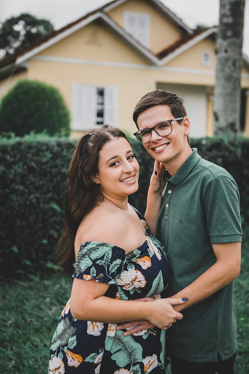 Smiling Young Couple in Backyard