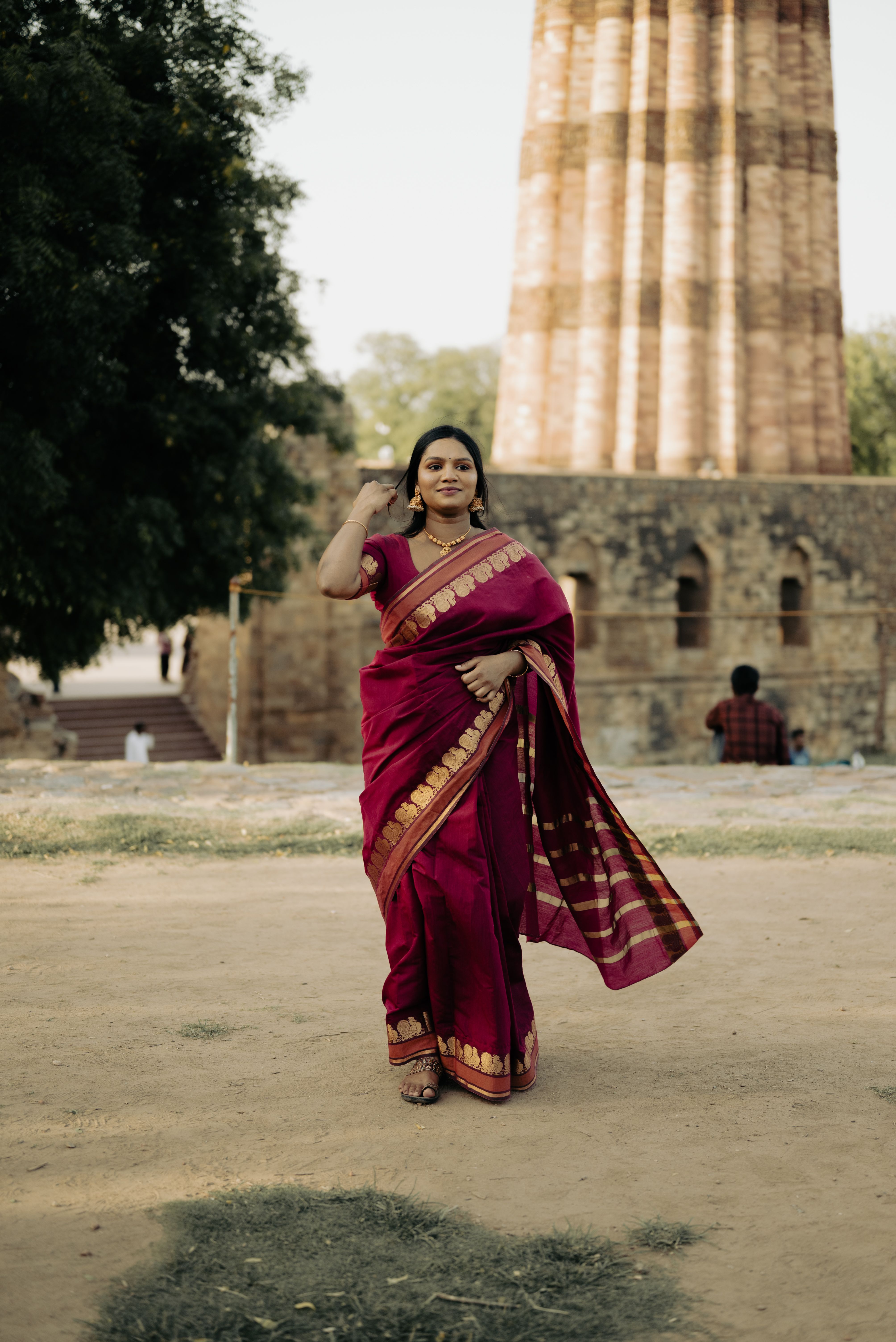 Young Woman in Traditional Dress Posing on Street · Free Stock Photo