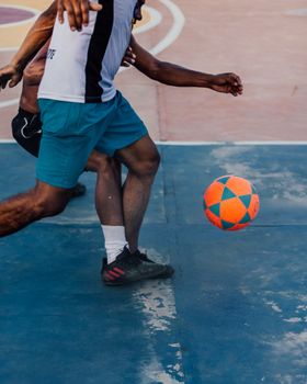 Athletes engaged in a high-energy soccer game, showcasing agility and teamwork.
