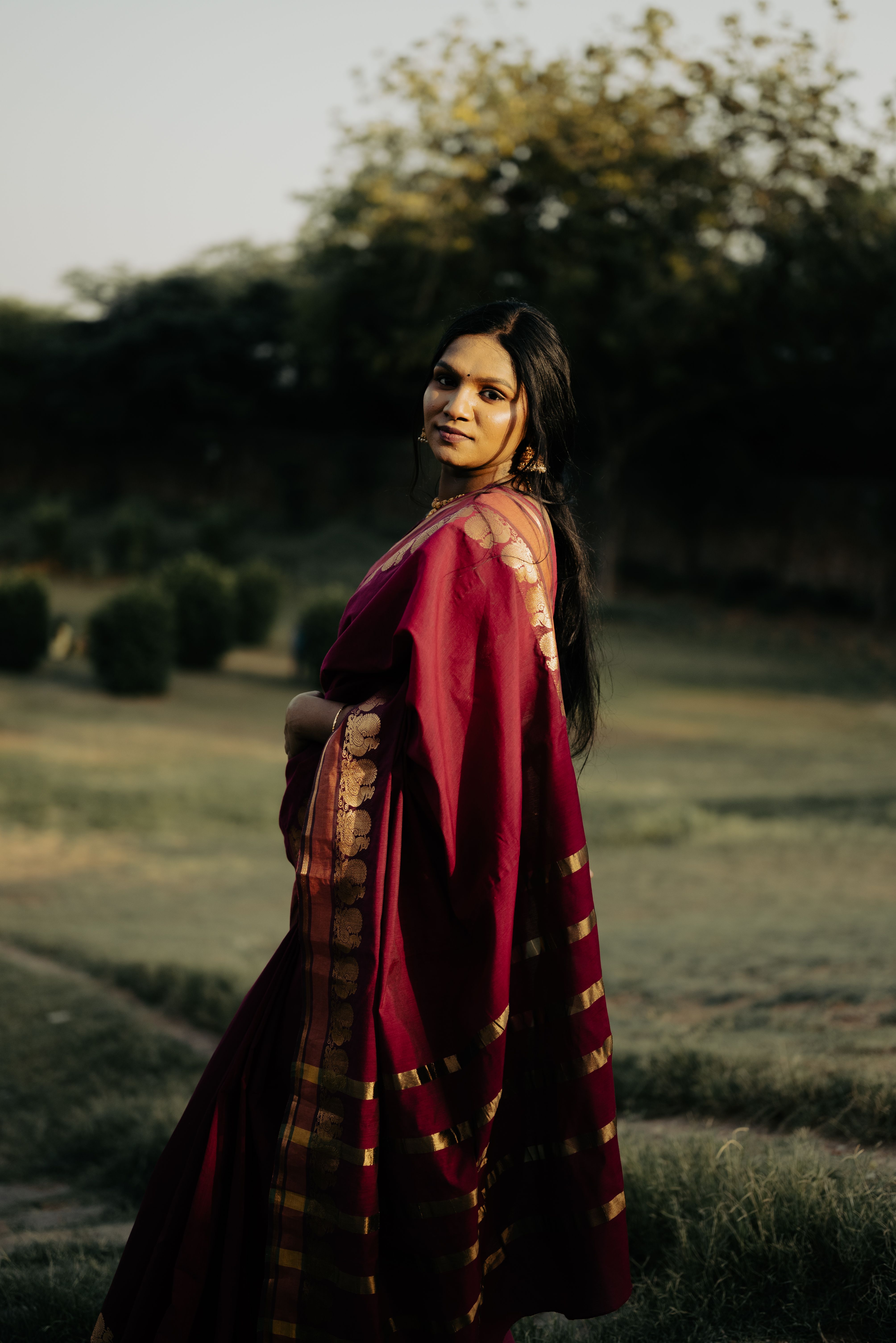 Young Woman in Traditional Dress Posing on City Square · Free Stock Photo