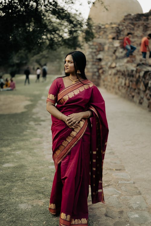 Indian Woman in Traditional Clothing Standing in the Street 