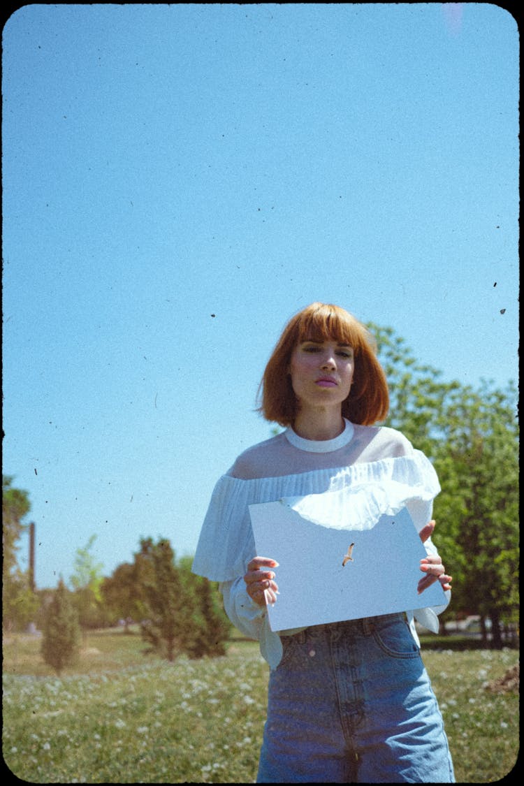 Woman Holding A Mirror 