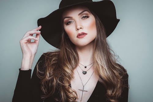 Young Woman Wearing a Black Hat