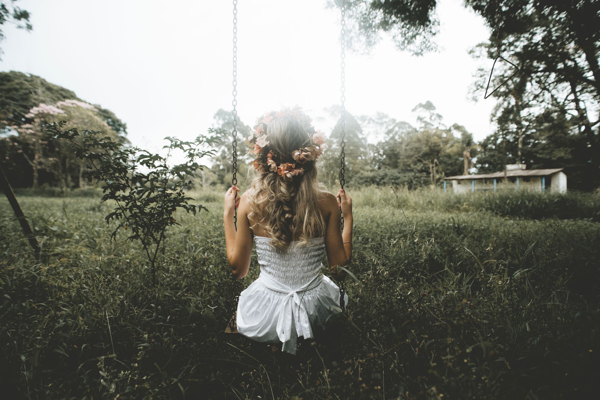 Woman with Wreath in Hair on Swing