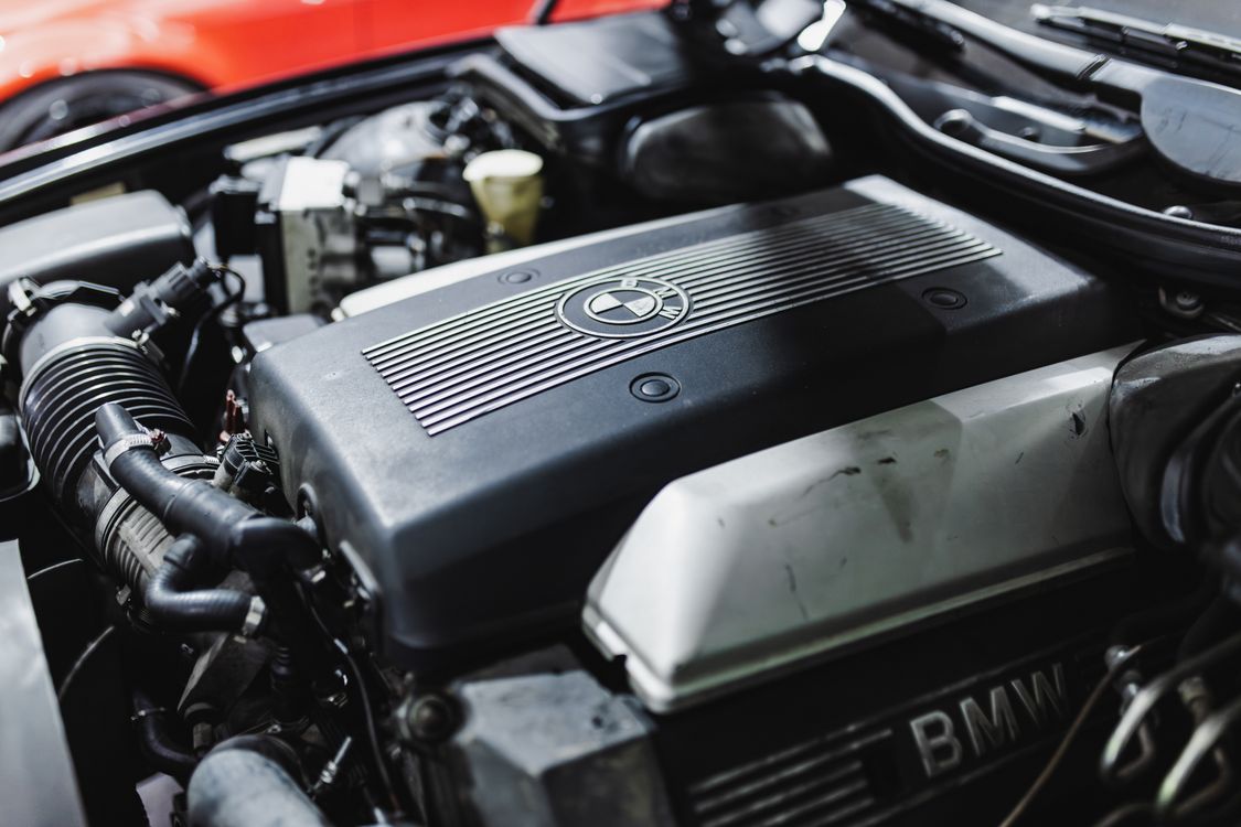 Close-up of Car Engine under Hood · Free Stock Photo