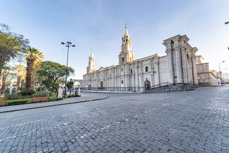 Stunning view of the Basilica Cathedral of Arequipa under clear skies, showcasing its architecture.