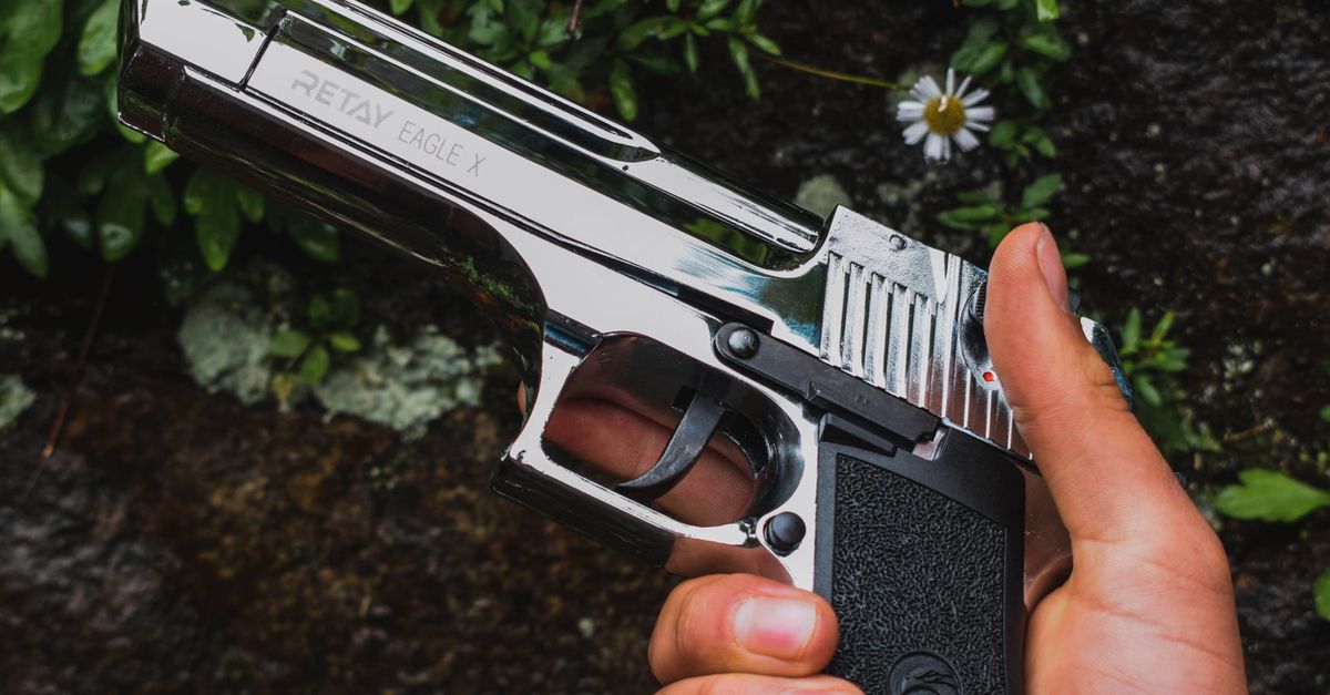 Photo of Hands Disarming a Gun · Free Stock Photo