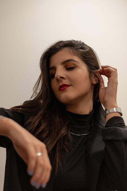 Free Elegant brunette in black posing with red lips, showcasing modern fashion style. Stock Photo