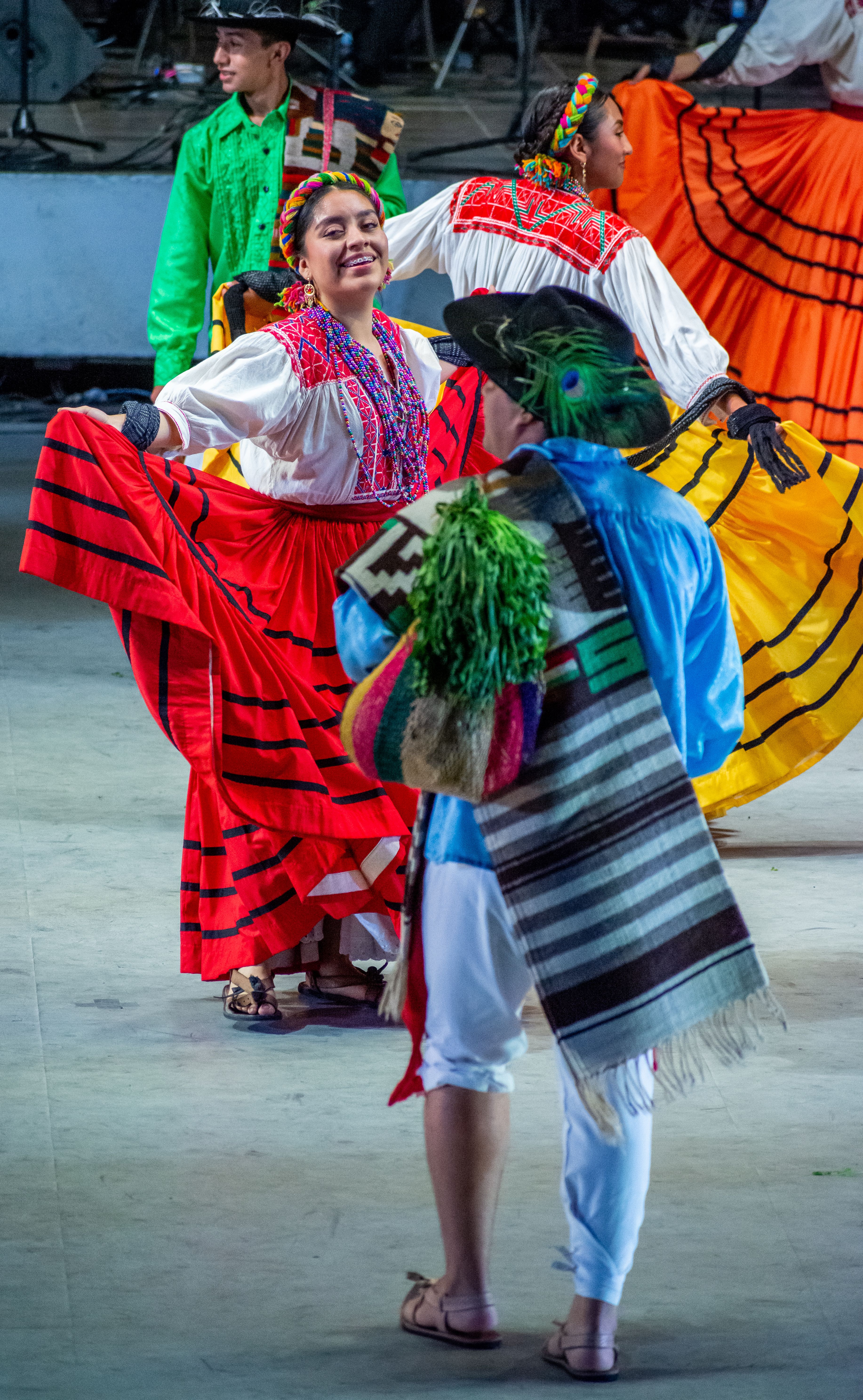 A group of people in colorful costumes dancing · Free Stock Photo