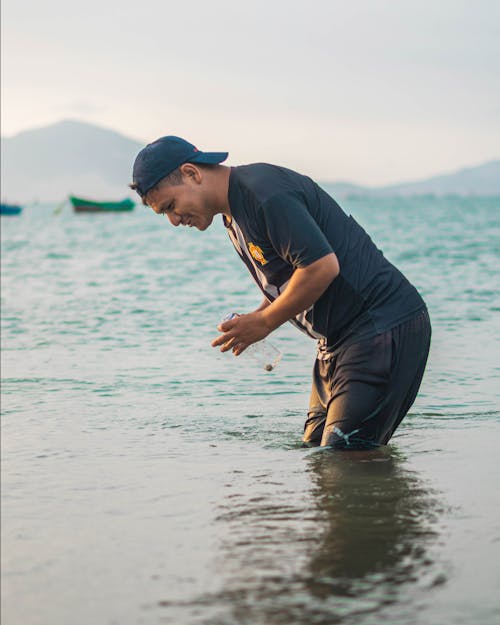 Man in Cap on Sea Shore