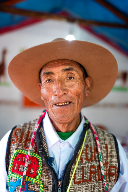 Elderly man wearing traditional Peruvian clothing and hat, smiling in Arequipa, Peru.