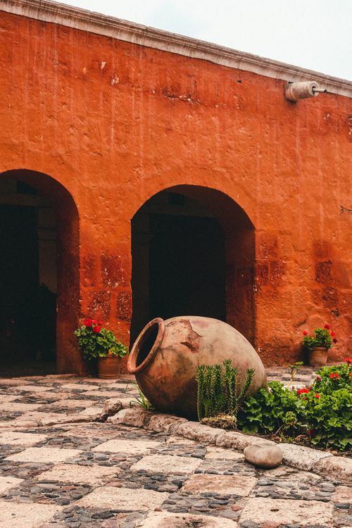 Free Explore the vibrant red walls of Santa Catalina Monastery, a historic landmark in Arequipa, Peru. Stock Photo