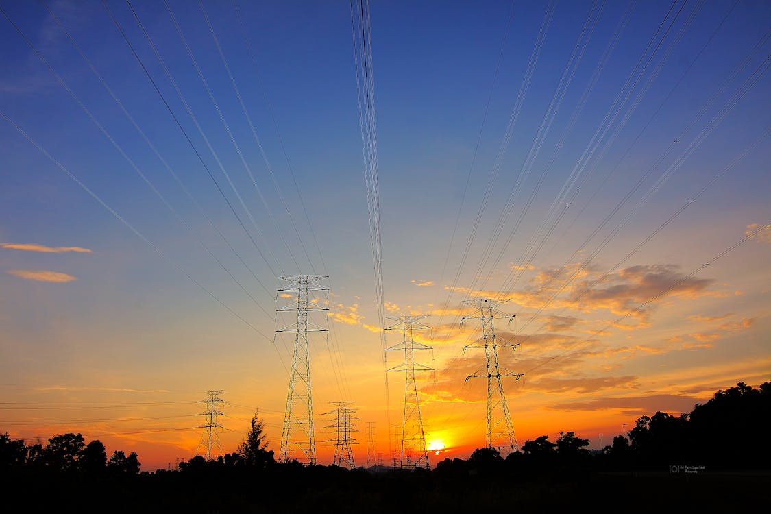 Grey Transmission Towers at Golden Hour