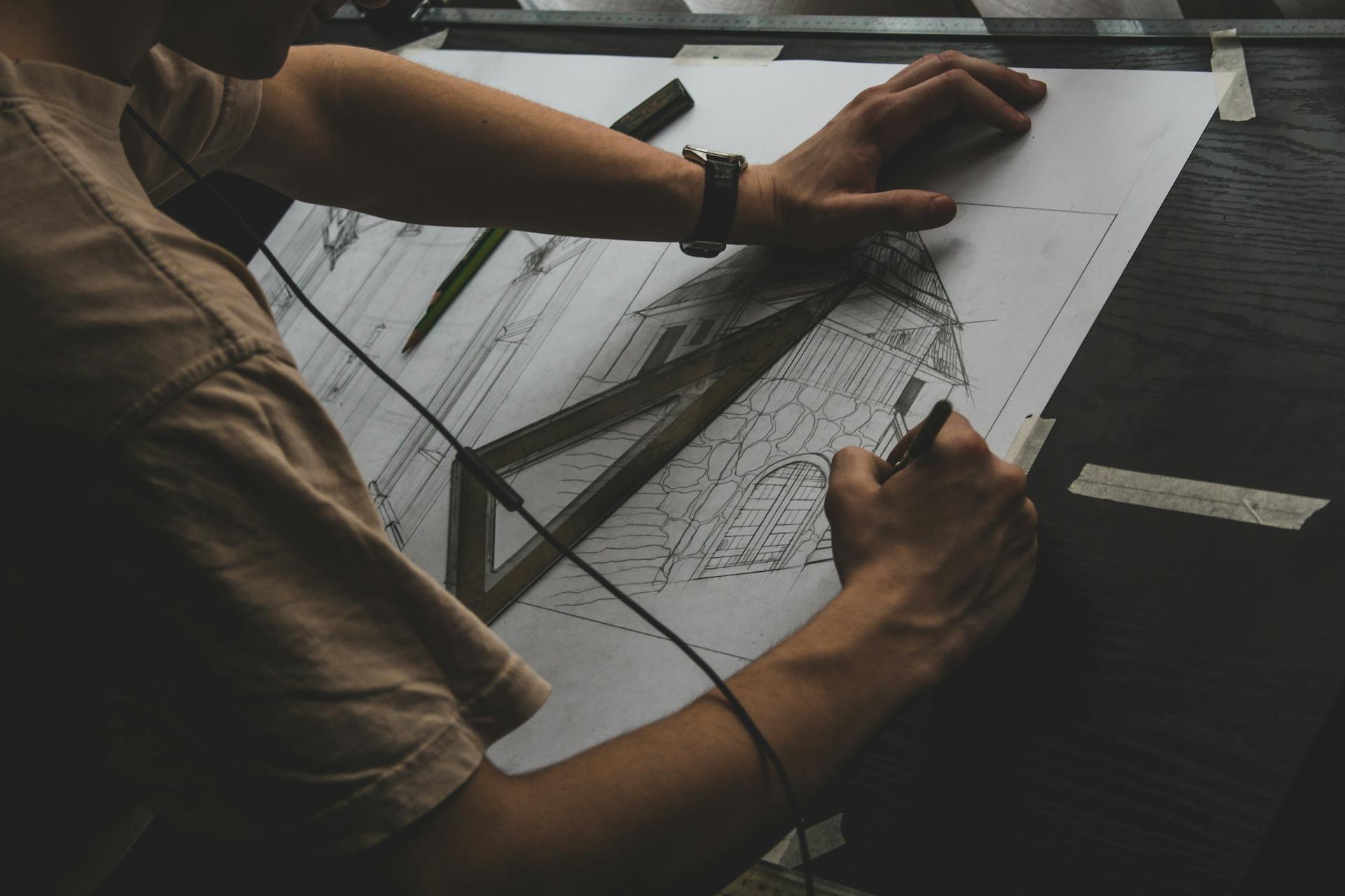 Closeup of a Man Drawing Architecture