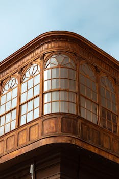 Elegant wooden facade captured in Trujillo, showcasing intricate decorative carvings.