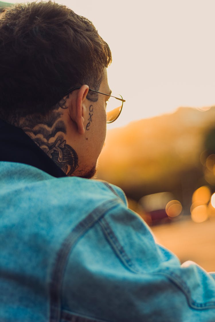 Man With Tattoo On Neck