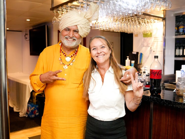 Man With Turban And Woman In Bar