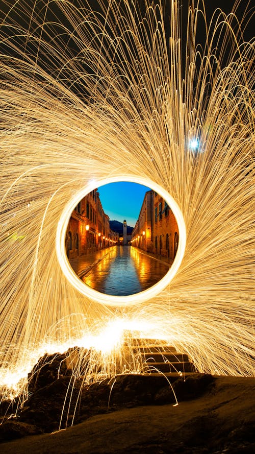 Steel Wool Photo with View of an Alley in City in the Circle in the Center