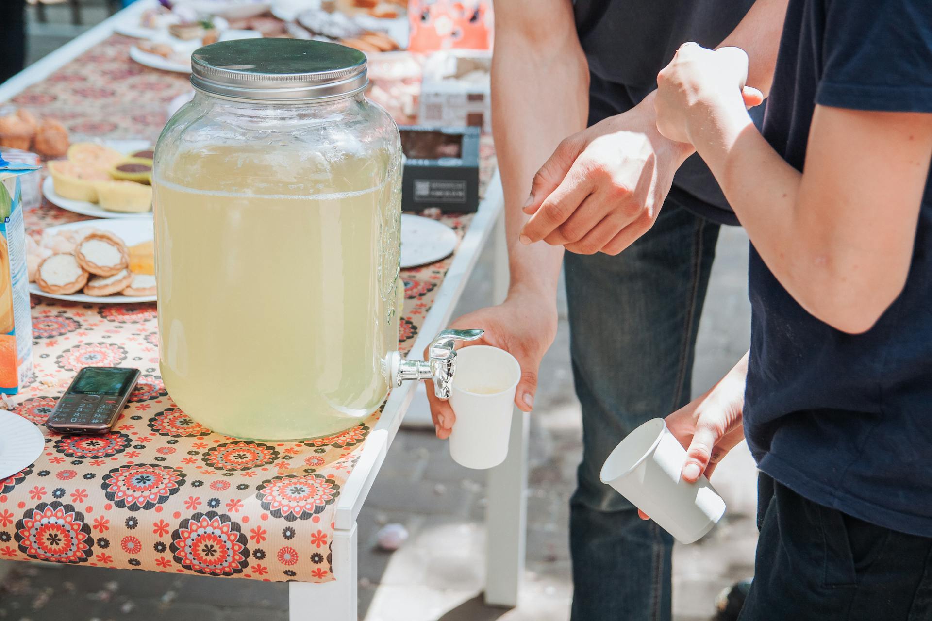 People Pouring Lemonade