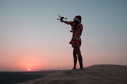 Photo of Woman Holding Quadcopter