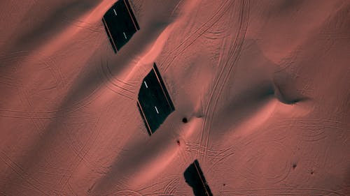 Aerial Photo of Concrete Road Covered With Sand