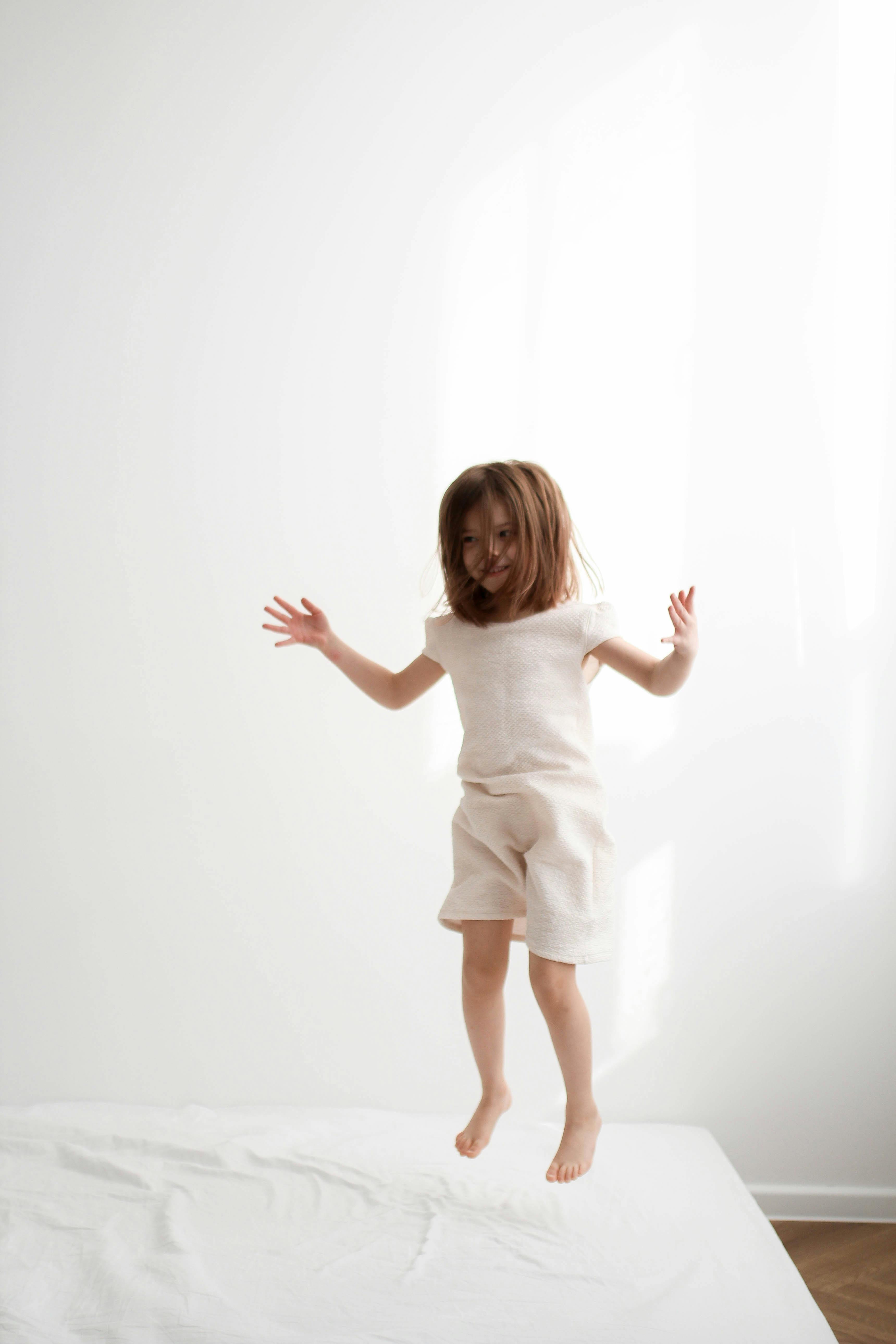Girl Jumping on Mattress · Free Stock Photo