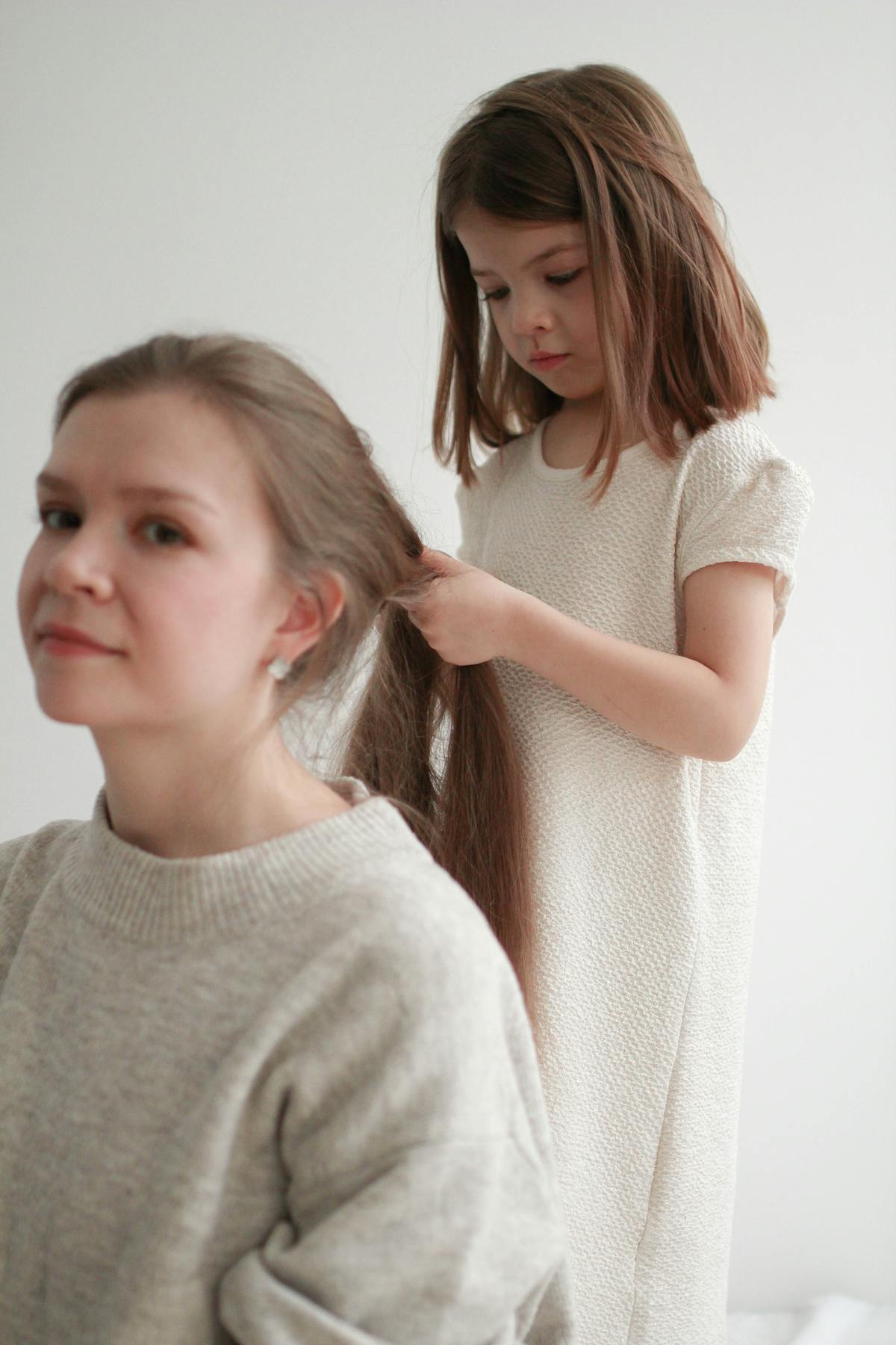 Mother Braiding Daughter Hair Photos, Download The BEST Free Mother