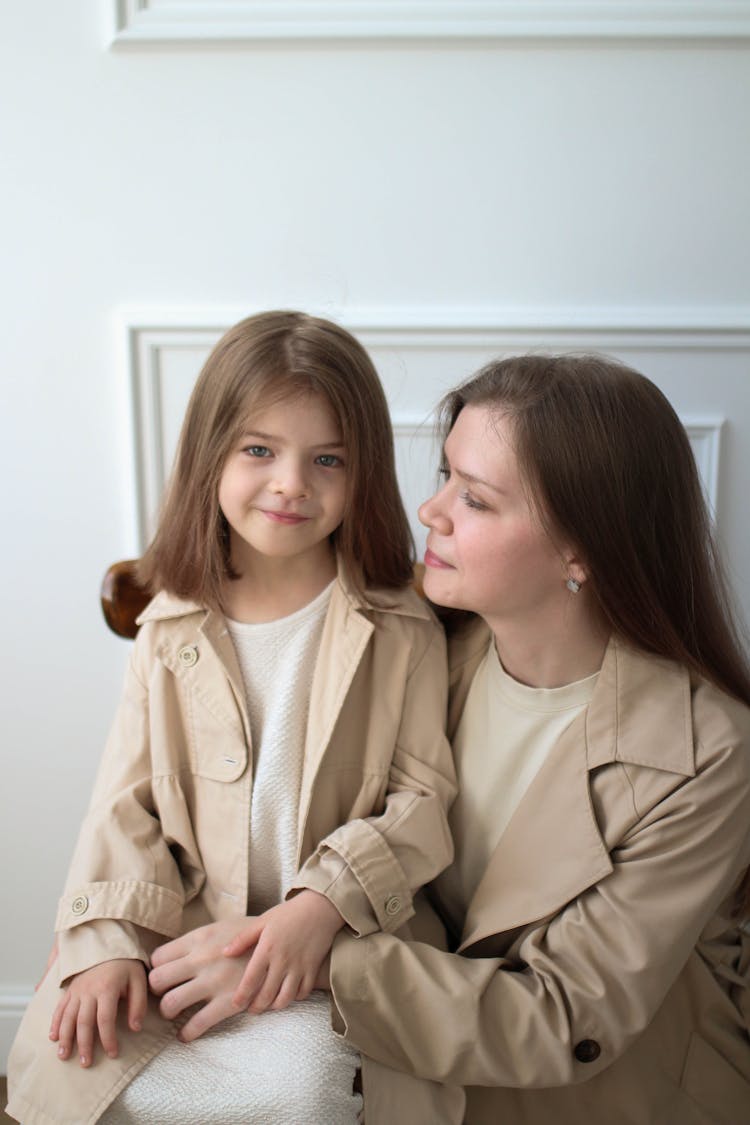 Teenage Girl Hugging A Younger Girl