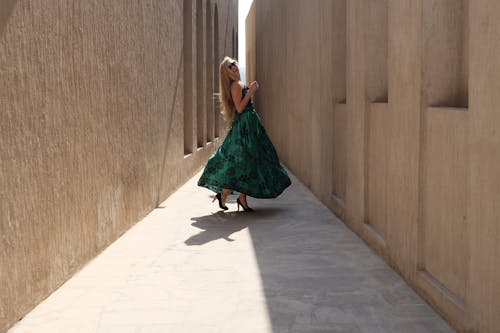 Photo of Woman Wearing Green Dress