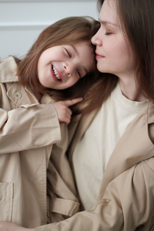 Coat Cuddle Closeup of a Mother and a Daughter Wearing Beige Coats, Cuddling · Free ...