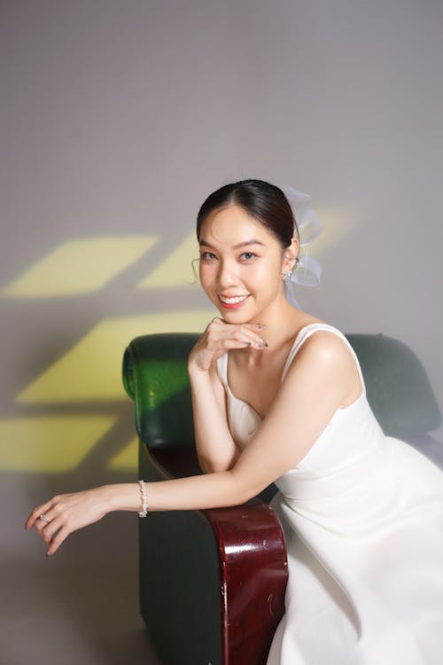 Smiling Bride Sitting in an Armchair 