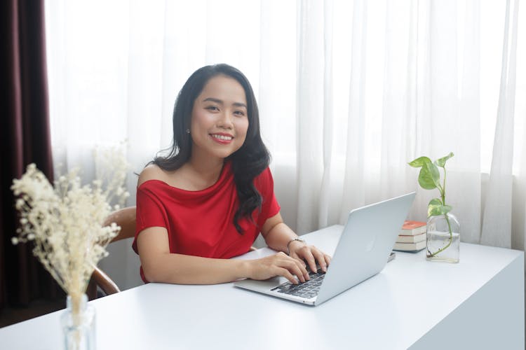 Businesswoman In Red Dress Working In Office