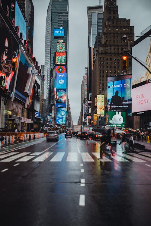 Free Man Crossing on Pedestrian Lane at Time Square, New York Stock Photo
