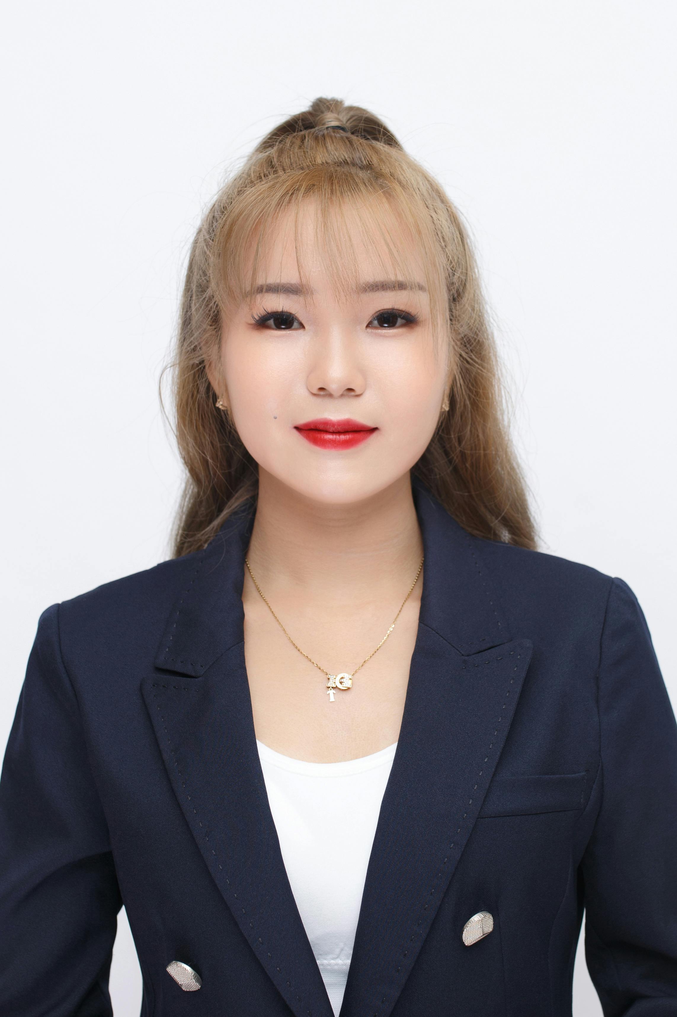 Portrait of an elegant businesswoman in a studio, exuding confidence and professionalism.